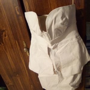 A sleeveless cream summer dress